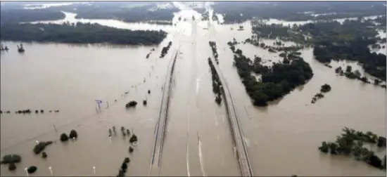  ?? ASSOCIATED PRESS ?? Interstate 69 is covered by floodwater­s from Tropical Storm Harvey Tuesday, Aug. 29, 2017, in Humble, Texas.