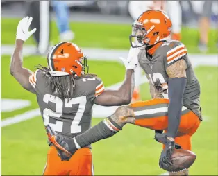  ?? Ron Schwane The Associated Press ?? Browns wide receiver Odell Beckham Jr., right, celebrates with running back Kareem Hunt after Beckham’s touchdown. Cleveland beat Cincinnati 35-30 in the battle of Ohio game.