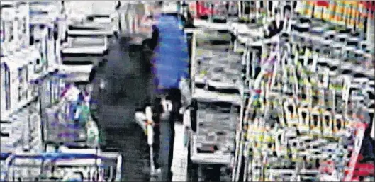  ?? PHOTO FROM VIDEO ?? Four days after she killed Marcel Reardon with a hammer that she purchased at the Topsail Road Wal-mart, Anne Norris returned to the store and attempted to buy other items, including two backpacks, a coat, scissors, Pepsi and two more hammers. In this...