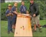  ??  ?? Cub Scouts raced their toy cars down an inclined plane.