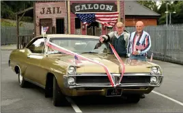  ?? Photo by Michelle Cooper Galvin ?? Pat Connell from Beaufort and Canada with the 1967 Pontiac Parisanne which he purchased in 1970 and participat­ed in the July 4 Parade with Pat Ferris Beaufort in Killarney on Monday.