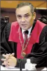  ?? AP/ARIANA CUBILLOS ?? Maikel Moreno, chief judge of Venezuela’s Supreme Court, said Saturday that the court had reversed a decision to strip lawmakers’ immunity from prosecutio­n as well as parts of a ruling removing some of their powers.