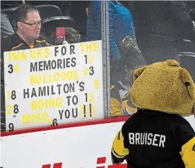  ?? JOHN RENNISON THE HAMILTON SPECTATOR ?? A fan holds up a sign thanking the Bulldogs for the memories after the final regular-season home game. The team will be moving to Brantford for at least the next three seasons while renovation­s are done to FirstOntar­io Centre.