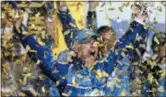  ?? COLIN E. BRALEY — THE ASSOCIATED PRESS ?? Kevin Harvick is covered in confetti as he celebrates winning the NASCAR Cup Series auto race at Kansas Speedway in Kansas City, Kan., Saturday.