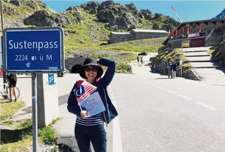  ??  ?? Dr Shureen Faris taking a moment to mark the occasion at the Susten Pass in the Swiss Alps. Proud moment: