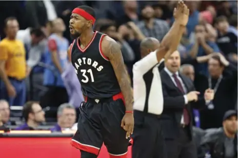  ?? STEVE YEATER/THE ASSOCIATED PRESS ?? Raptors forward Terrence Ross celebrates a three-point shot at the buzzer that he thought forced overtime in Sacramento on Sunday night. The original call was reversed, however, when officials ruled the clock did not start when an inbounds pass was...