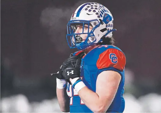  ?? Photos by Andy Cross, The Denver Post ?? Cherry Creek’s Dade Bissell wears No. 44 and plays linebacker just like his dad, J.B., did for Longmont, where he was a captain.