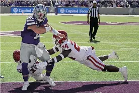  ?? AP Photo/Charlie Riedel, File ?? ■ In this Oct. 26, 2019, file photo, Kansas State quarterbac­k Skylar Thompson (10) runs into the end zone to score a touchdown as Oklahoma linebacker Brian Asamoah (24) and safety Pat Fields (10) defend during the second half of an NCAA college football game in Manhattan, Kan. Kansas State won, 48-41. Thompson is now set to make his 29th career start when the Wildcats try to only their fifth win ever over a top-five team, this week against Oklahoma. This matchup will be in Norman.