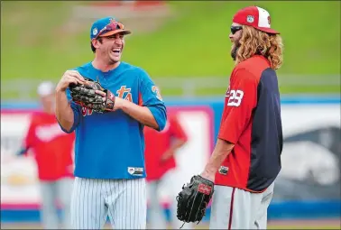  ?? JOHN BAZEMORE/AP PHOTO ?? Mets pitcher Matt Harvey, the former Fitch High School star, jokes with Nationals left fielder Jayson Werth, right, before a spring training game on March 27 at Port St. Lucie, Fla.