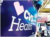  ??  ?? In this file photo, the CVS Health logo appears above a trading
post on the floor of the New York Stock
Exchange. (AP)