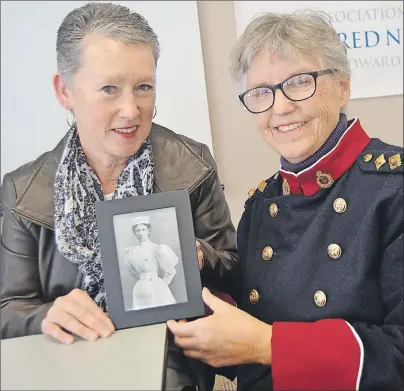  ?? SALLY COLE/THE GUARDIAN ?? Associatio­n of Registered Nurses of Prince Edward Island (ARNPEI) president Cynthia Bryanton, left, and author Katherine Dewar hold a photo of nursing hero Georgina Fane Pope. The ARNPEI is recognizin­g Pope as its champion during National Nursing Week...