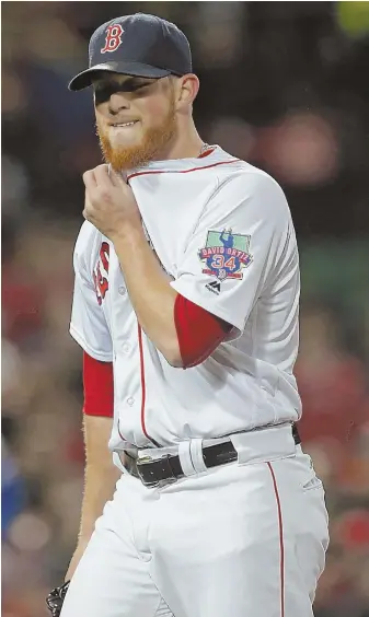  ?? STAFF PHOTO BY JOHN WILCOX ?? HOT UNDER THE COLLAR: Craig Kimbrel walks to the dugout after yielding the winning run in the ninth inning of the Sox’ loss to the Blue Jays last night at Fenway.