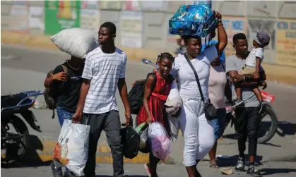  ?? Photograph: Odelyn Joseph/AP ?? Residents of the Solino neighbourh­ood displaced from their homes due to clashes between armed gangs.