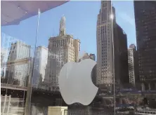  ?? AP FILE PHOTO ?? ‘COMMITTED TO QUALITY JOURNALISM’: Apple has bought digital magazine service Texture. At right, an Apple Store in Chicago is shown last fall.