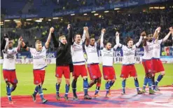  ??  ?? HAMBURG: Hamburg players celebrate after winning the German first division Bundesliga soccer match between Hamburger SV and Borussia Dortmund in Hamburg on Friday, Nov 20, 2015. — AP