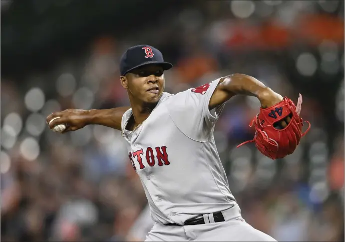  ?? NICK WASS — THE ASSOCIATED PRESS ?? Boston Red Sox starting pitcher Brayan Bello strides toward the plate during a Sept. 9, 2022 game in Baltimore. He’s a big part of the Red Sox plans.