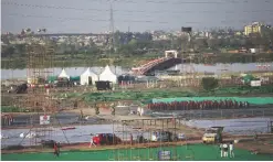  ??  ?? NEW DELHI: In this file photo, workers dismantle stadia temporaril­y erected for a massive three-day cultural festival organized by the Art of Living Foundation on the banks of the river Yamuna in New Delhi, India.—AP