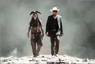  ??  ?? Johnny Depp, left, as Tonto, and Armie Hammer, as The Lone Ranger, are shown in a scene from the film “The Lone Ranger.”