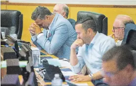  ?? JULIE JOCSAK THE ST. CATHARINES STANDARD ?? Regional councillor­s listen during Thursday night’s council meeting when elected officials discussed the recently released Ombudsman report into the seizure of a Standard reporter’s equipment at a meeting last December.