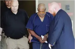  ?? —AP ?? James Mathew Bradley Jr, 60, of Clearwater, Florida is escorted out of the federal courthouse following a hearing on in San Antonio. Bradley was arrested in connection with the deaths of multiple people packed into a tractor-trailer.