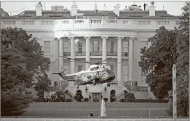  ?? AP-J. Scott Applewhite ?? Marine One lifts off from the White House to carry President Donald Trump to Walter Reed National Military Medical Center in Bethesda, Md., on Friday in Washington.