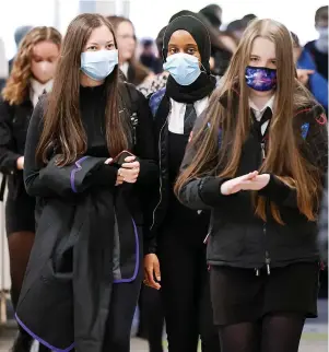  ?? Jeff J Mitchell ?? Pupils pictured in masks earlier this year at a school in Glasgow – face masks are returning to Winterbour­ne Academy in South Gloucester­shire after the half-term