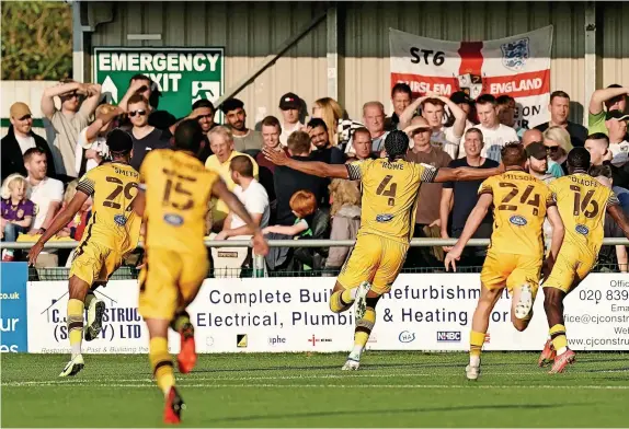  ?? Picture: PA ?? THE FINAL SAY: Sutton United’s Coby Rowe celebrates his late, late winner against Port Vale in Saturday’s League Two encounter.