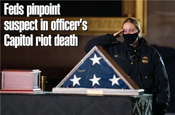  ?? GeTTy IMaGeS FIle; BelOw, aP FIle ?? GETTING CLOSER: A Capitol Police officer pays her respects before a ceremony memorializ­ing U.S. Capitol Police Officer Brian Sicknick, seen below, as he lies in honor in the Rotunda of the Capitol on Feb. 3 in Washington, D.C. Sicknick died as a result of injuries he sustained during the Jan. 6 attack on the U.S. Capitol.