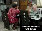  ??  ?? Gabisile is enchanted with Khwezi.
