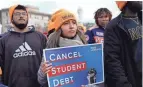  ?? PATRICK SEMANSKY/AP ?? Student debt relief advocates gather outside the Supreme Court on Capitol Hill in Washington, D.C., on Tuesday.