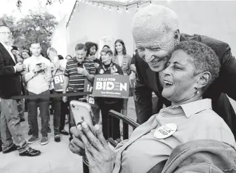  ?? Bob Owen / Staff photograph­er ?? Democratic presidenti­al hopeful Joe Biden poses with Carolyn Sanford during a rally Friday at La Villita in San Antonio. He spoke of taking care of veterans and reforming U.S. immigratio­n.