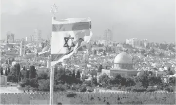  ??  ?? File photo shows an Israeli flag is seen near the Dome of the Rock, located in Jerusalem’s Old City on the compound known to Muslims as Noble Sanctuary and to Jews as Temple Mount. — Reuters photo