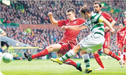  ??  ?? Ryan Jack puts in a tackle on Shaun Maloney while playing for Aberdeen at Celtic Park in 2010, with Paul Hartley providing some cover