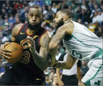  ?? MICHAEL DWYER — THE ASSOCIATED PRESS FILE ?? Cavaliers’ LeBron James (23) drives against Celtics’ Marcus Morris (13).