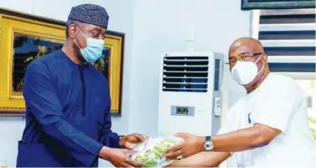  ??  ?? Otunba Abimbola Ogunbanjo(left), president, National Council, The Nigerian Stock Exchange (NSE), presenting a gift to Governor Hope Uzodinma of Imo State, during a courtesy visit to the Imo State Government House, recently