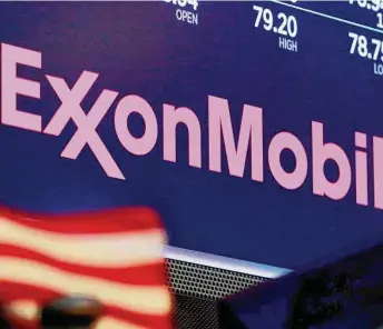  ?? Richard Drew/Associated Press file photo ?? The author contends Exxon Mobil belongs on the Dow Jones Industrial Average, the world’s most famous stock index, after its expulsion in 2020 as investor mood over climate has changed.