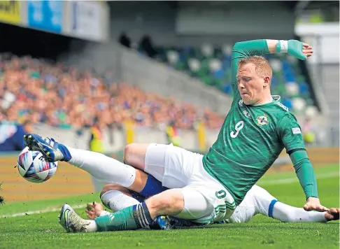  ?? ?? BATTLING DRAW: Northern Ireland’s Shayne Lavery tangles with Cyprus defender Konstantin­os Laifis.