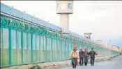  ?? REUTERS ?? ■
Workers near a ‘vocational camp’ in Dabancheng, China.