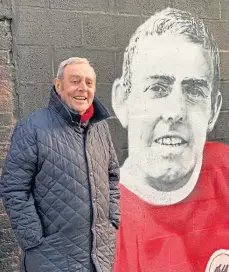  ??  ?? RED LEGEND: Ian St John with a mural of himself.
