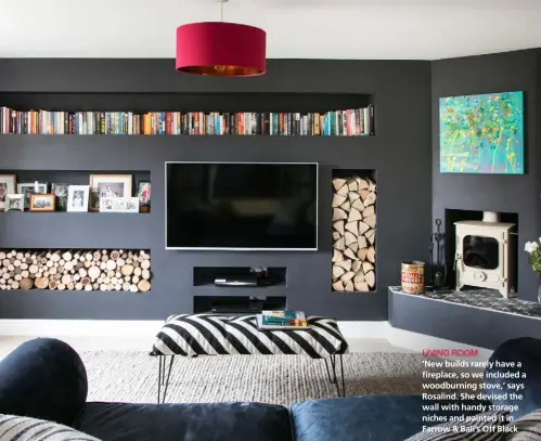  ??  ?? LIVING ROOM ‘New builds rarely have a fireplace, so we included a woodburnin­g stove,’ says Rosalind. She devised the wall with handy storage niches and painted it in Farrow & Ball’s Off Black