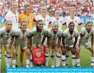  ??  ?? PARIS: File photo shows US players pose ahead of the France 2019 Women’s World Cup quarter-final football match between France and USA, at the Parc des Princes stadium in Paris. A federal judge dismissed the United States women’s soccer team’s bid for equal pay on May 1, 2020, rejecting claims the players had been underpaid in a crushing defeat for the reigning world champions. — AFP