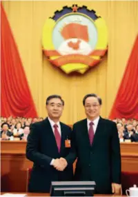  ??  ?? March 14, 2018: Yu Zhengsheng (right), chairman of the 12th National Committee of the Chinese People’s Political Consultati­ve Conference (CPPCC), shakes hands with Wang Yang at the fourth plenary meeting of the first session of the 13th CPPCC National...