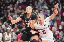  ?? Sean Rayford/Associated Press ?? Stanford’s Haley Jones boxes out South Carolina’s Victaria Saxton last Dec. 21 in Columbia, S.C. The Gamecocks won 65-61.