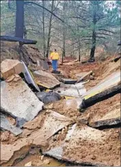  ?? Associated Press ?? NEAR IDYLLWILD, part of Highway 243 collapsed because of erosion caused by recent rainstorms.