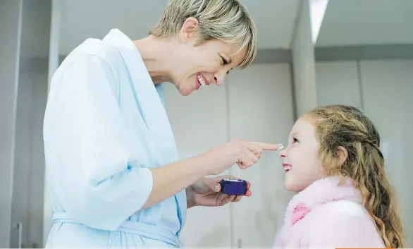  ?? GETTY IMAGES ?? Avoid conflict by trying to apply sunscreen when your child is in a good mood, rather than when you’re both in a mad rush.