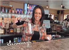  ?? WOOD, MILWAUKEE JOURNAL SENTINEL ?? Bartender Christina Belcher pours wine that's from a monthly wine club at Papa Stache Pub & Eatery in Big Bend.