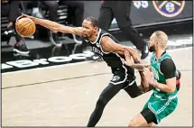  ??  ?? Brooklyn Nets forward Kevin Durant, (left), reaches for the ball in front of Boston Celtics guard Evan Fournier during the second half of Game 1 of an NBA basketball first-round playoff series in New York. (AP)
