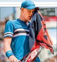  ??  ?? HOT AND BOTHERED: Edmund towels off in Paris, where he suffered defeat