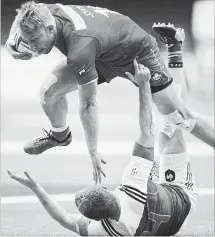  ?? CANADIAN PRESS FILE PHOTO ?? Canada’s Harry Jones, top, collides with France’s Thibauld Mazzoleni while running with the ball during World Rugby Sevens Series action in Vancouver on March 11.