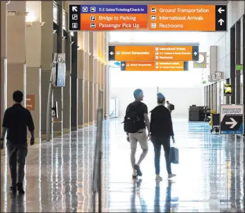  ?? Bizuayehu Tesfaye Las Vegas Review-journal @btesfaye ?? Passengers walk at Terminal 3 at Harry Reid Internatio­nal Airport on June 24. The internatio­nal traveler is an important demographi­c to Las Vegas, officials say.